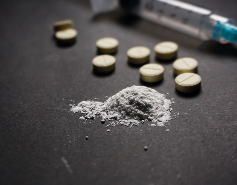 Pills and white powder representing benzo fury addiction.