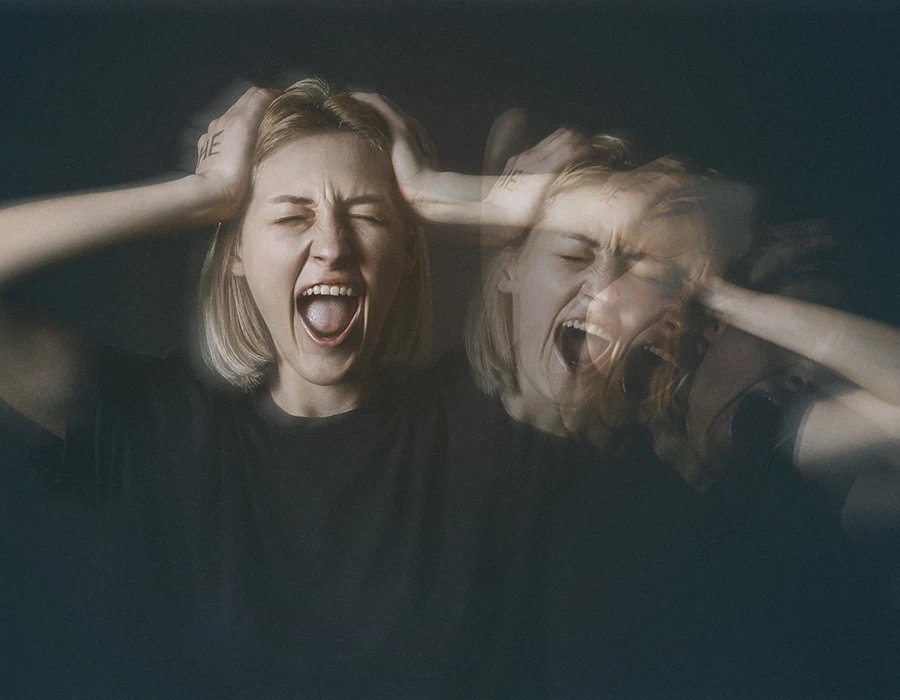 Woman experiencing distress and hallucinations associated with cannabis psychosis.