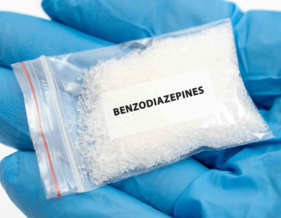 Bag of white benzodiazepine crystals illustrating addiction.