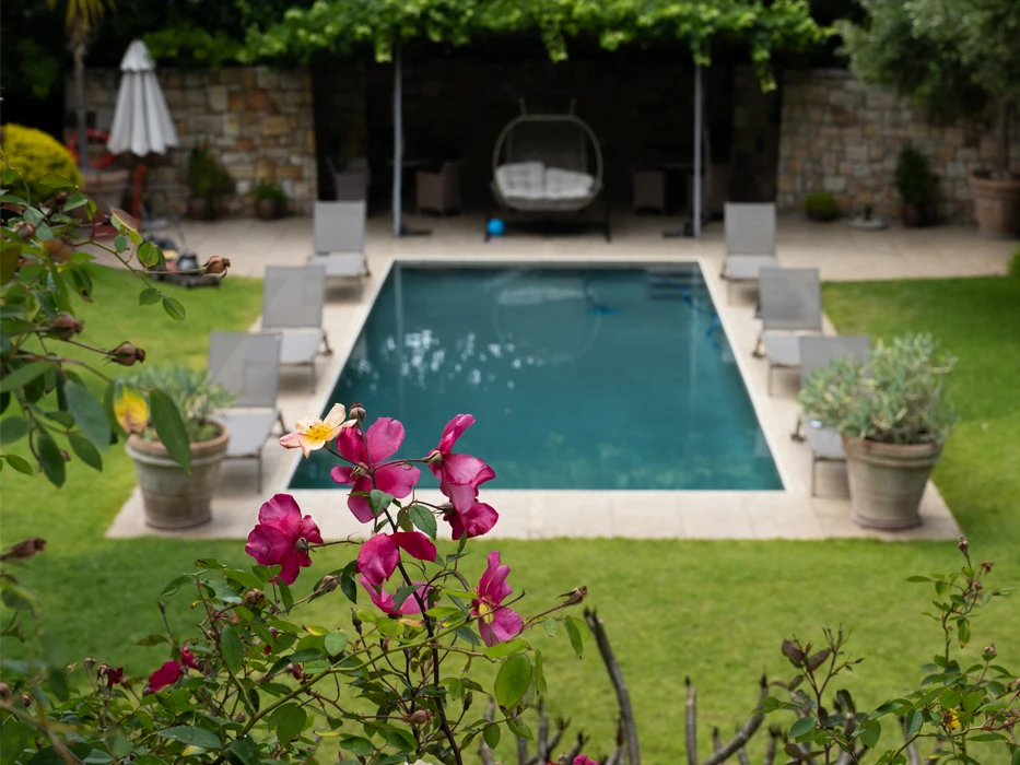 Pool with lounge beds an in the rehab centre Connection MHC garden in South Africa.