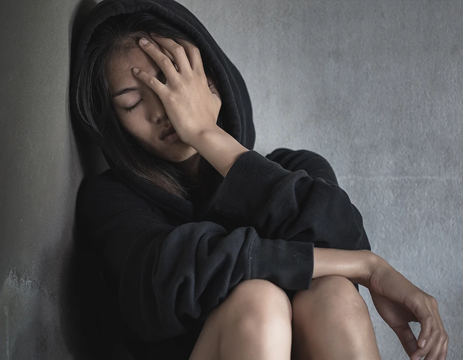 Woman experiencing stress and discomfort during weed withdrawal.