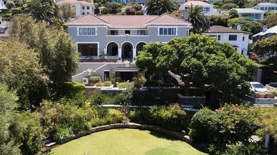 Overview picture showing the rehab centre Connection MHC in South Africa, surrounded by trees and a lawn.