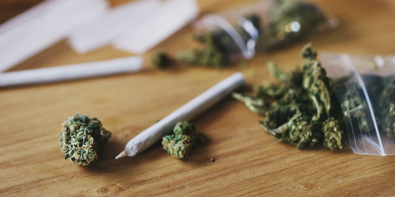 Cannabis buds and joints on a wooden table, illustrating weed side effects